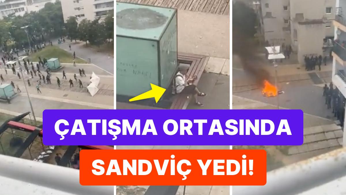 Fransa'da İsyancılar ve Polisin Çatıştığı Anlarda Sandviçini Yiyen Adamın Rahatlığı 'Yok Artık' Dedirtti!